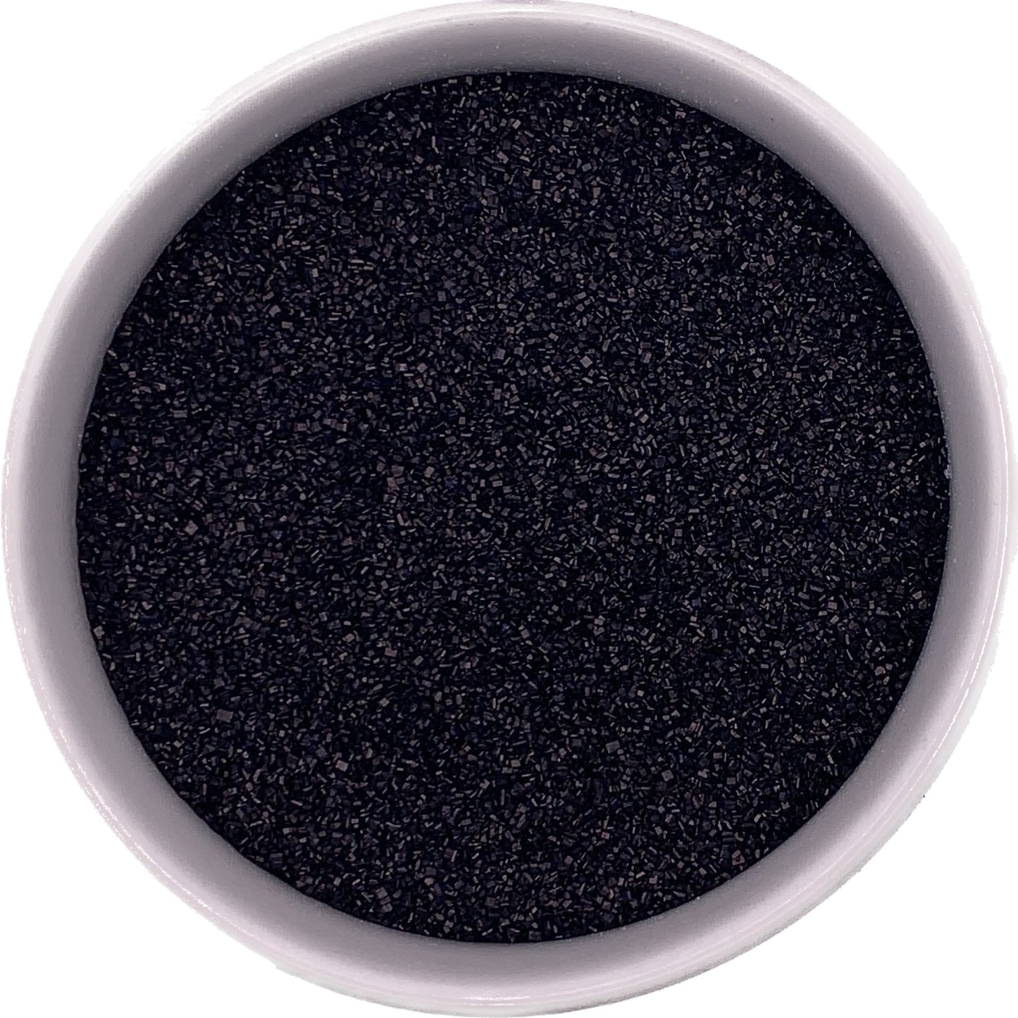 Close-up of black granulated sugar in a white bowl.