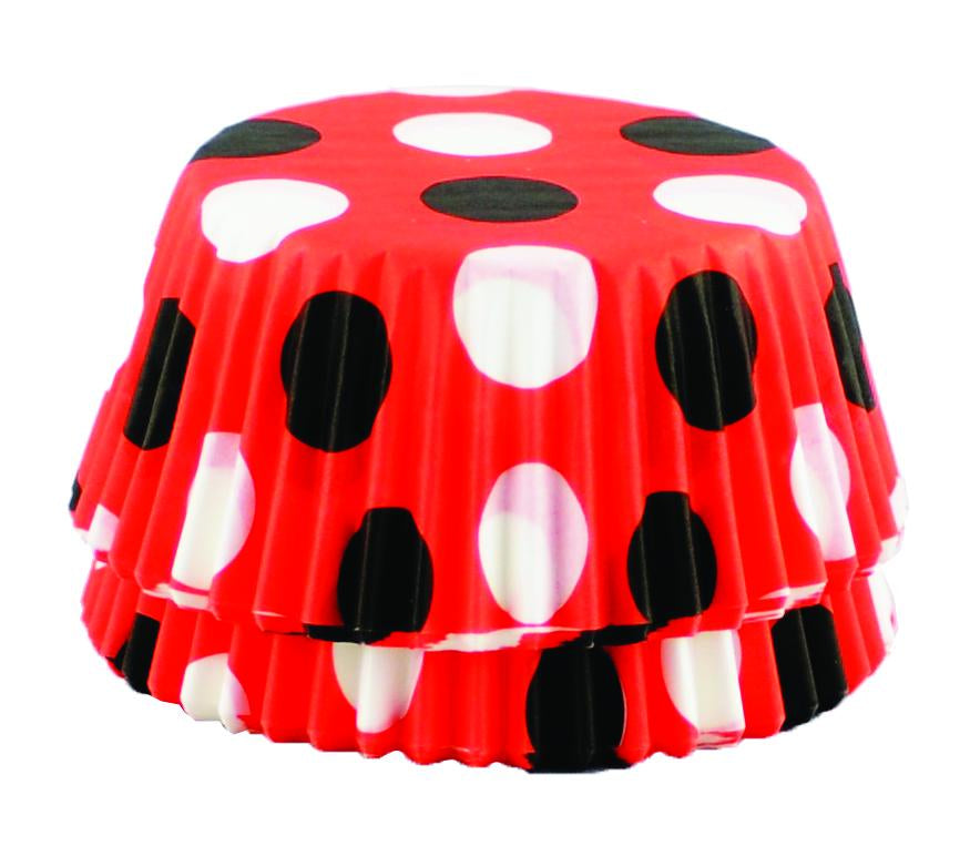 Stack of red cupcake liners decorated with black and white polka dots, arranged in a neat pile.