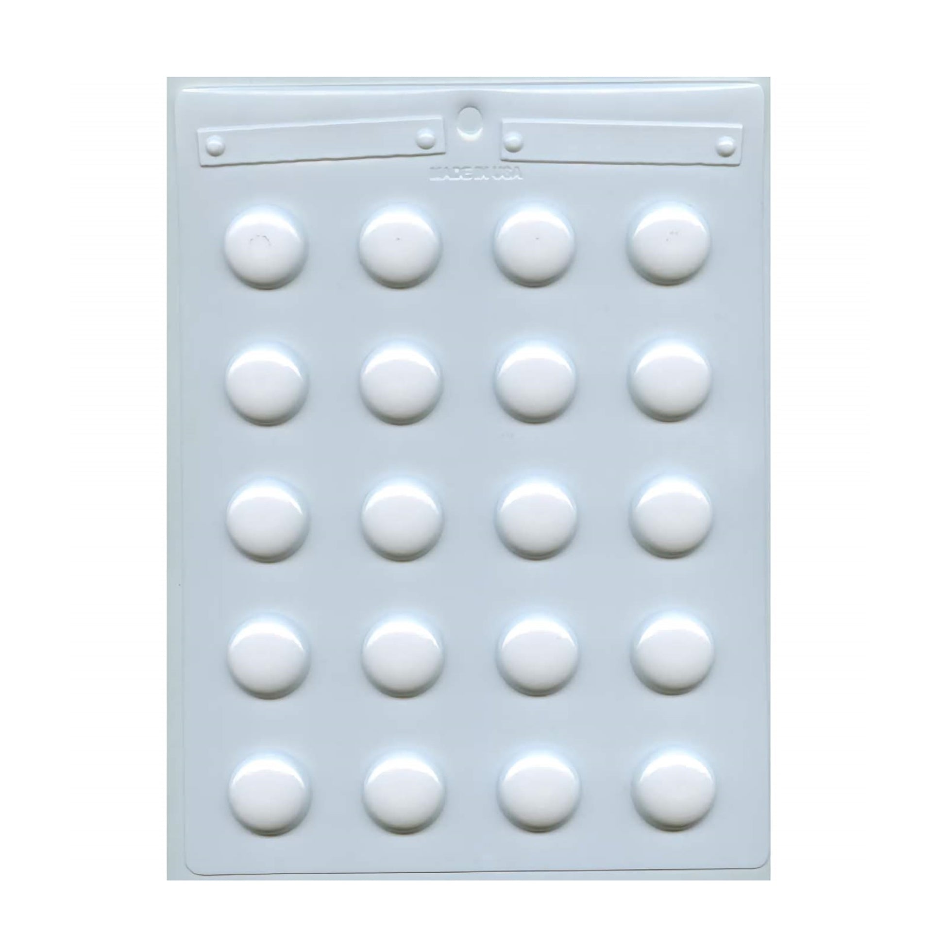 A hard candy mold with 1" round cavities. There are 20 cavities on the mold spaced evenly apart.