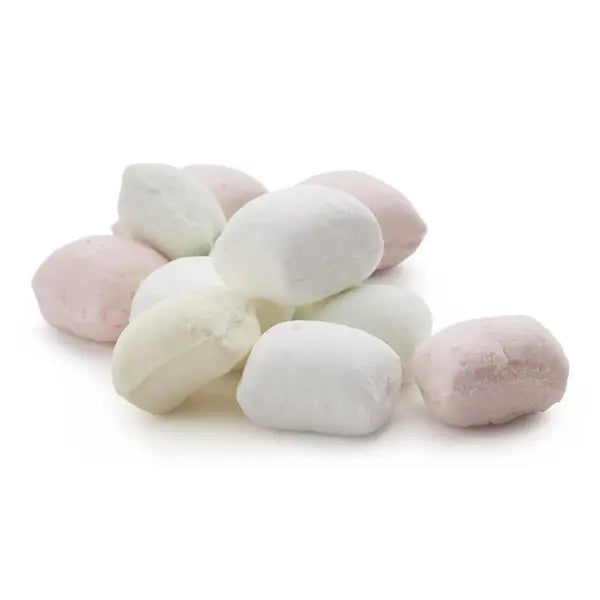 Pastel-colored butter mints on a white background