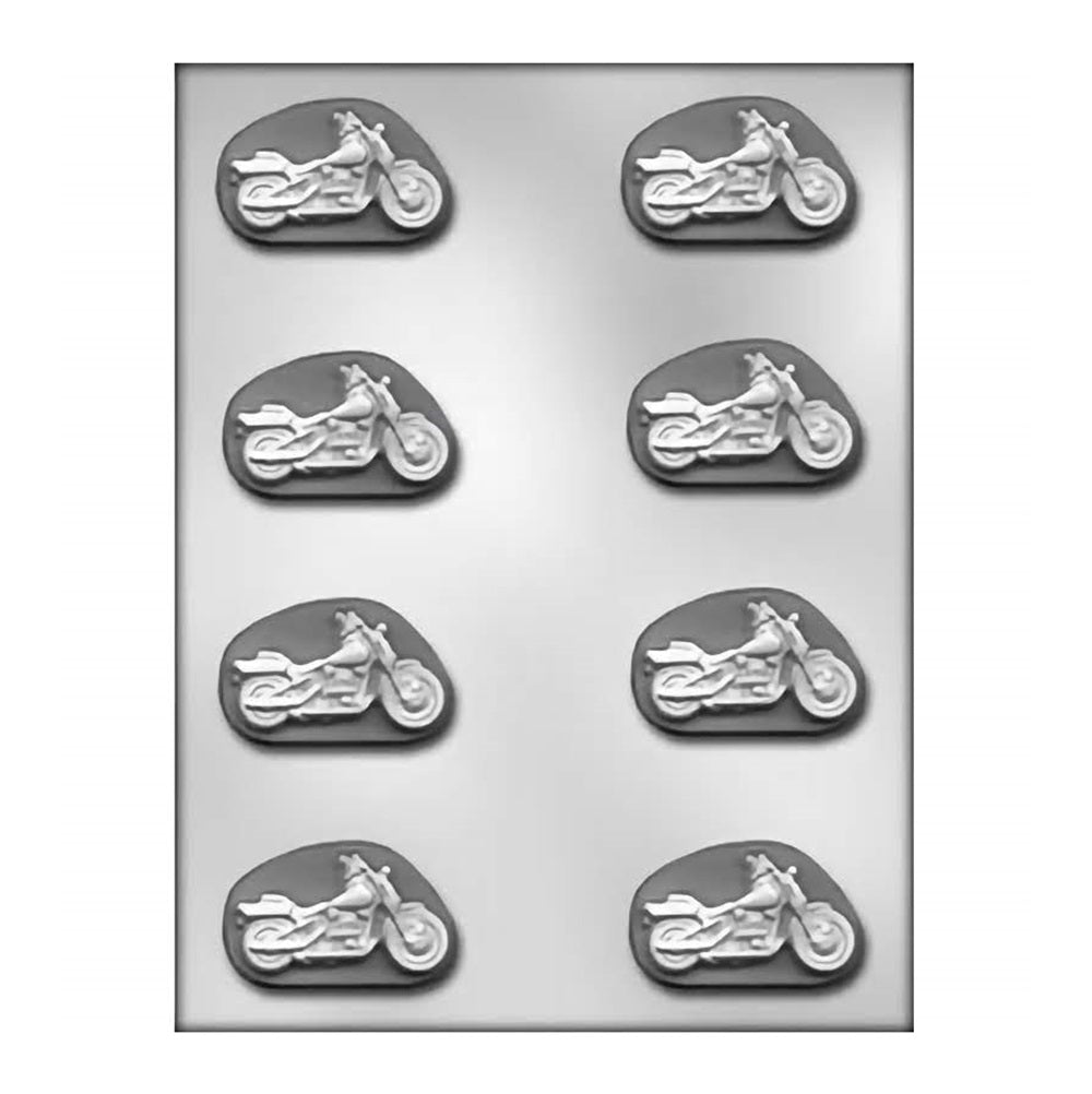 Chocolate mold tray with multiple cavities shaped as motorcycles, each approximately 2 inches in size, perfect for creating biker-themed chocolates or mints.