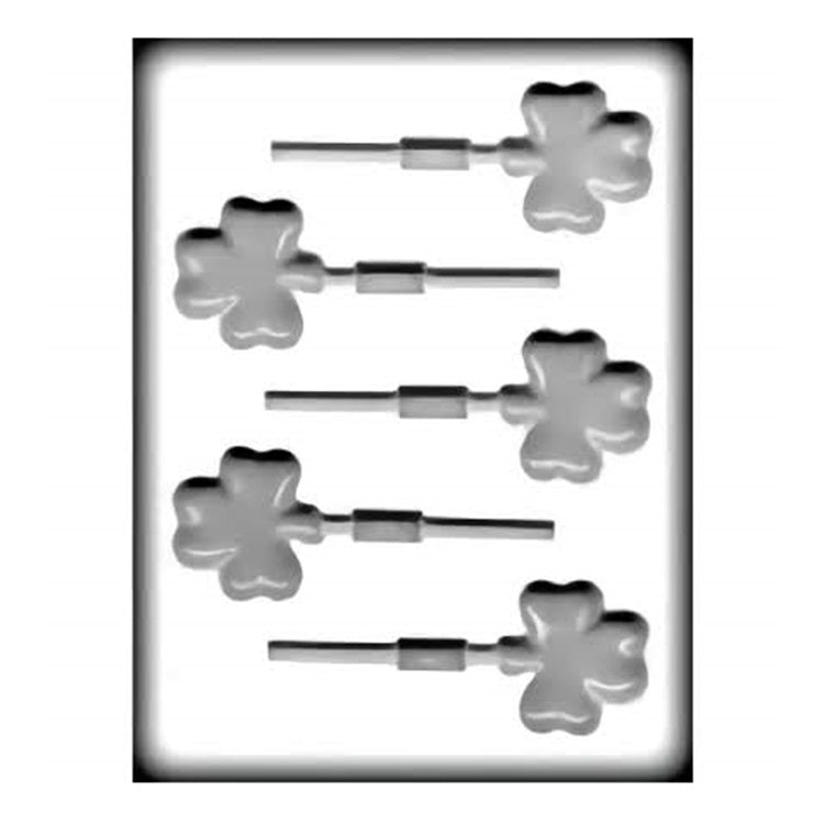 A white hard candy mold that makes shamrock shaped suckers. This mold has 5 cavities on it with a slot in each for a sucker stick.