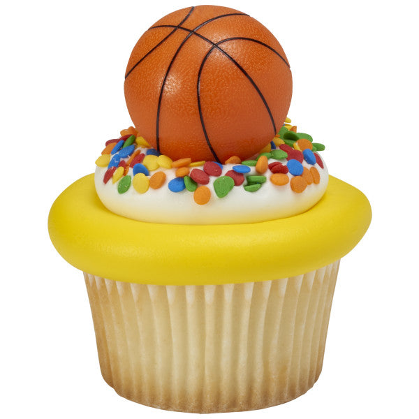 Cupcake with yellow frosting, rainbow confetti sprinkles, and a 3D basketball cupcake ring.