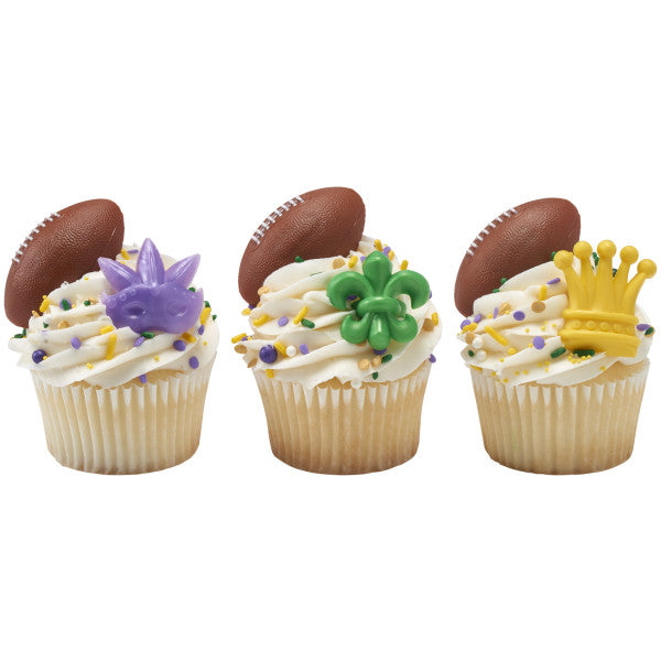 Three cupcakes decorated with 3D football rings and Mardi Gras-themed toppers in purple, green, and gold.