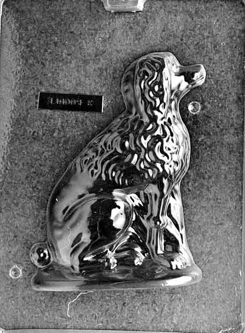 Clear plastic chocolate mold showing the matching back half of a seated poodle with hind leg and tail shaping and continued textured fur detail, designed to pair for a complete 3D figure.