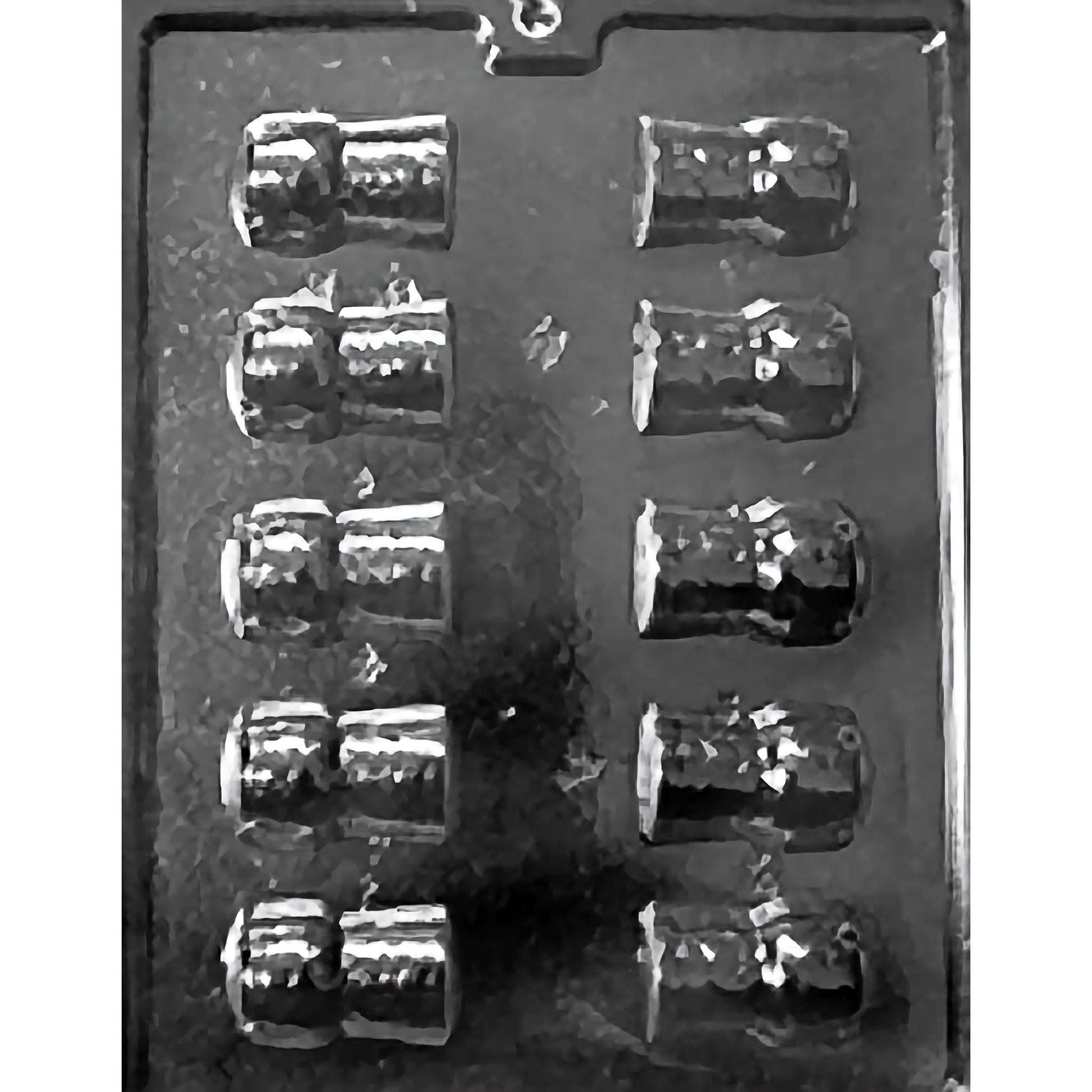 Plastic chocolate mold with twelve small champagne-cork cavities for making mini champagne cork chocolates.