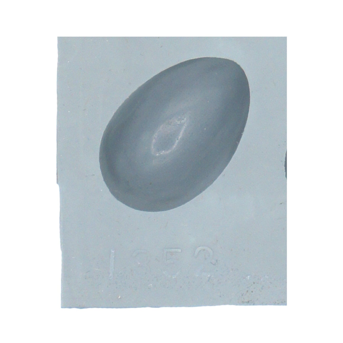 Close-up of a small egg-shaped cavity in a natural rubber mint mold, ideal for making cream cheese mints or Easter-themed candies.
