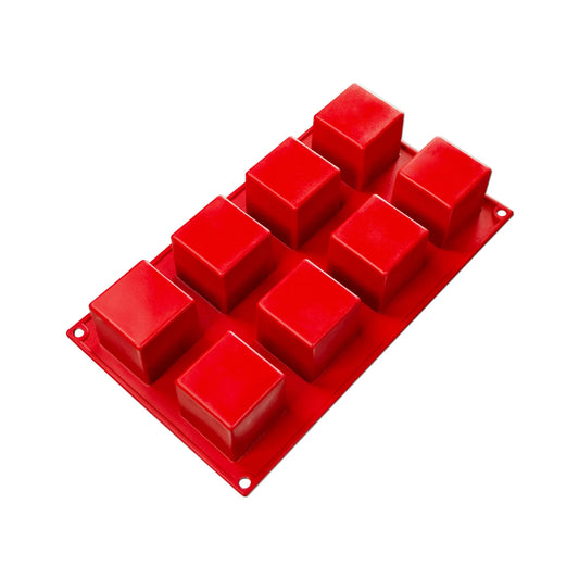 Fat Daddio's Silicone Baking Cube Mold in red, featuring eight cube-shaped cavities. Made from food-grade silicone, flexible, non-stick, and temperature-safe from -40°F to 550°F.