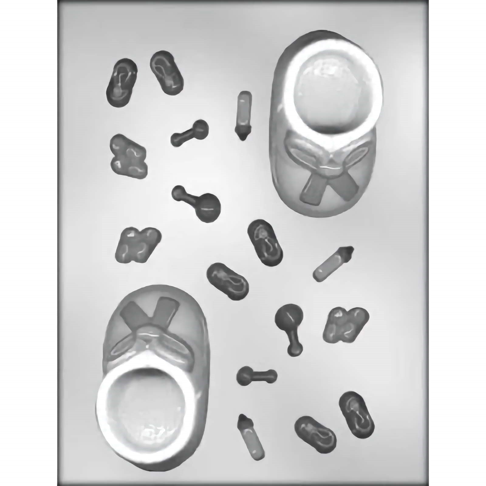 Clear plastic chocolate mold with two large cavities shaped like baby booties with ribbon details and several smaller cavities featuring baby-themed items such as bottles, rattles, and safety pins.