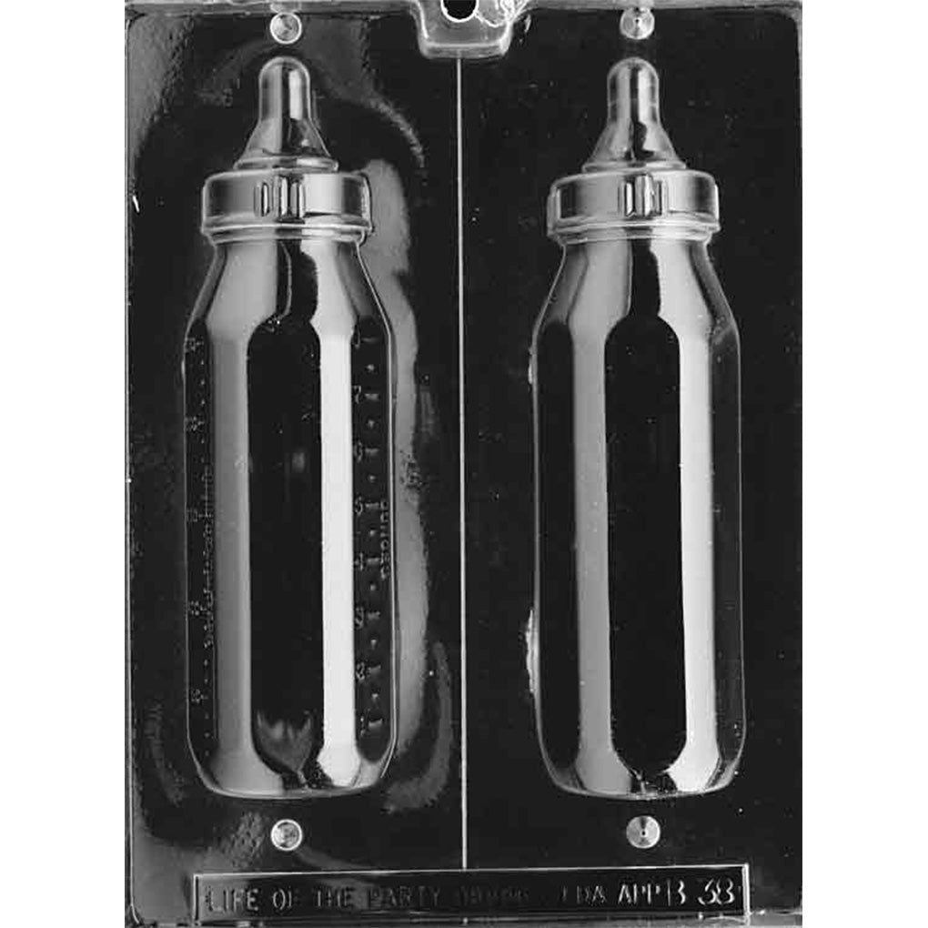 Clear plastic 3D chocolate mold photographed on a black background with two large baby bottle-shaped halves, featuring a bottle body, ring collar, and nipple top.