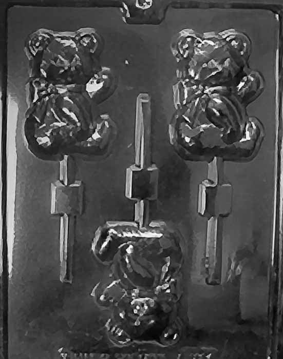 Lollipop cavity of a seated teddy bear with rounded belly and small bow detail.