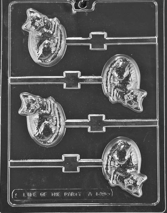 Lollipop cavities of a cat face with pointed ears and smile lines; stick channels included.