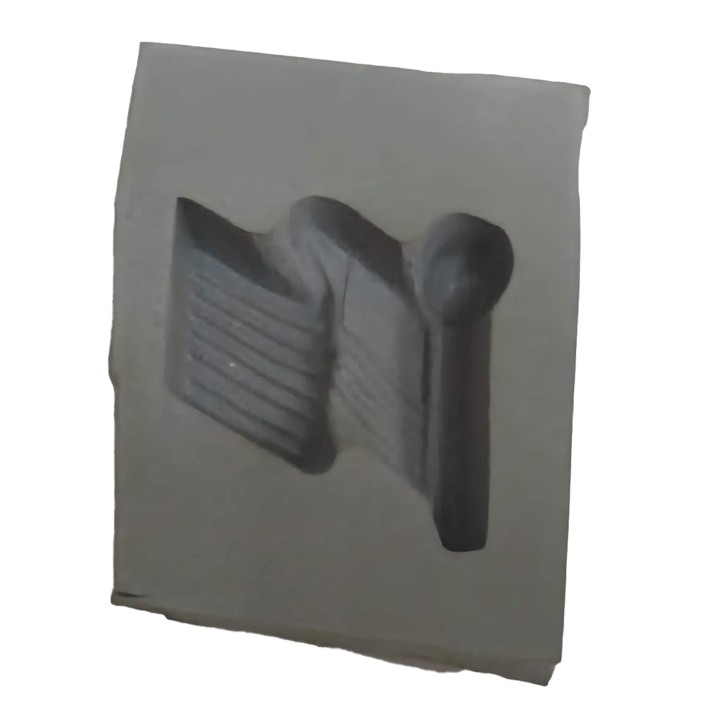 Close-up of a cream cheese mint rubber mold with an American flag design indentation.