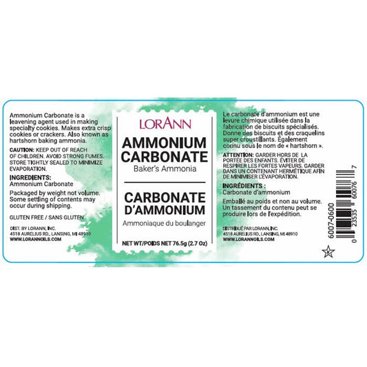 LorAnn Ammonium Carbonate label close-up with green watercolor-style background, ingredient and caution text, and net weight 2.7 oz.