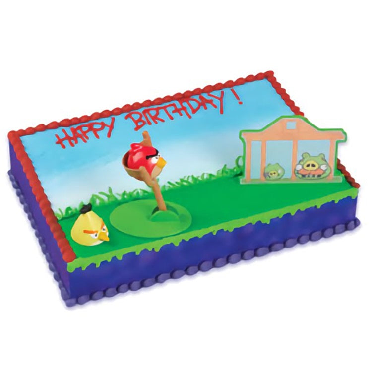 A cake decorating kit featuring characters from 'Angry Birds', with Red, Chuck, and the Pigs, perfect for a themed birthday cake design.
