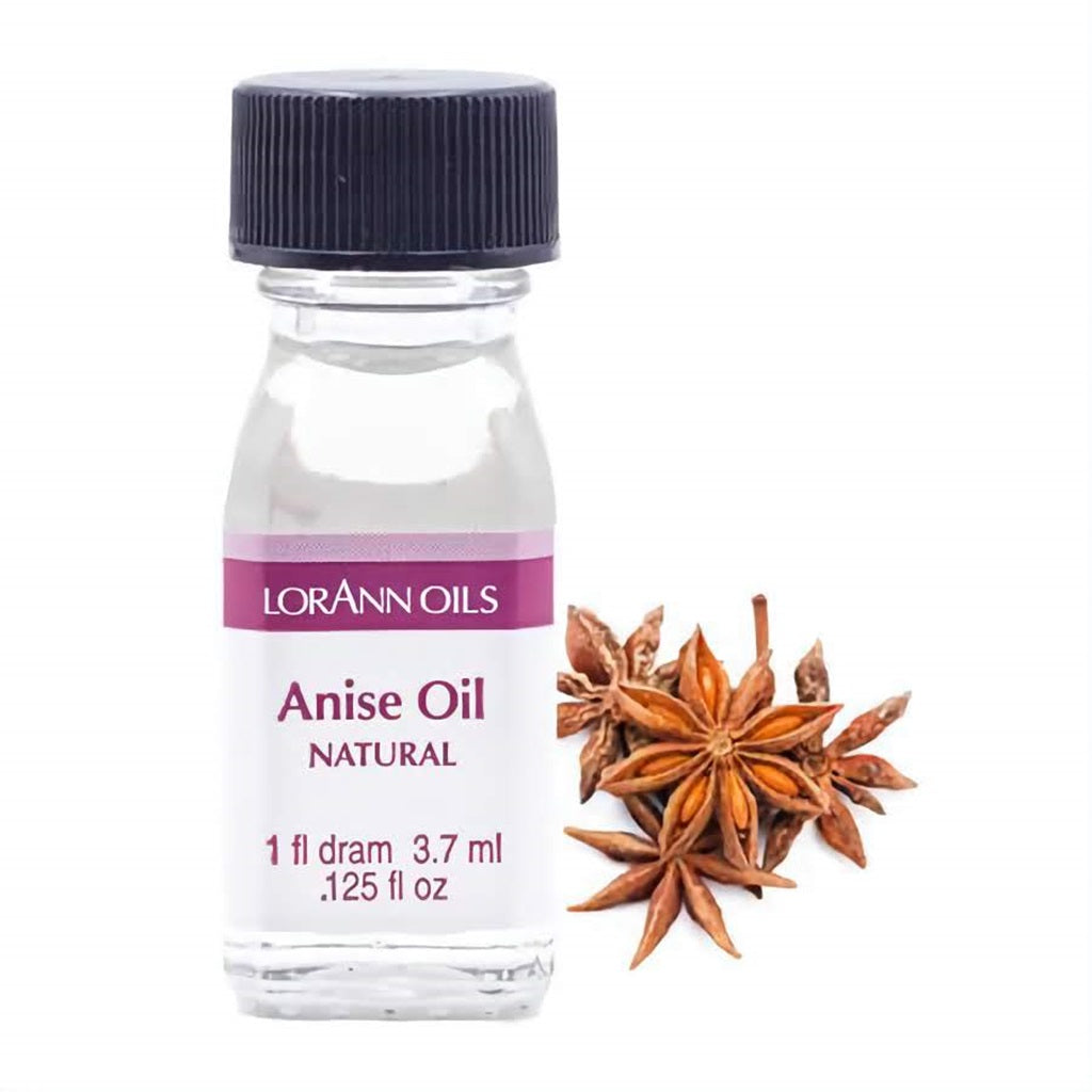 Small bottle of LorAnn Oils natural anise oil with star anise beside it.