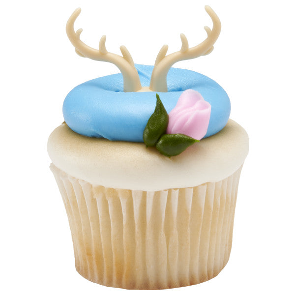 Baby shower cupcake with blue and white frosting, pink rose detail, and antler ring topper