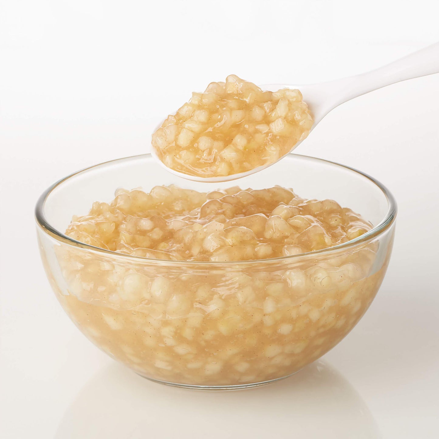 Classic apple cake and pastry filling, ready to use in sealed packaging, contains tender apple pieces enrobed in a cinnamon-spiced syrup, ready to be used in creating homestyle apple pies or Danish pastries.