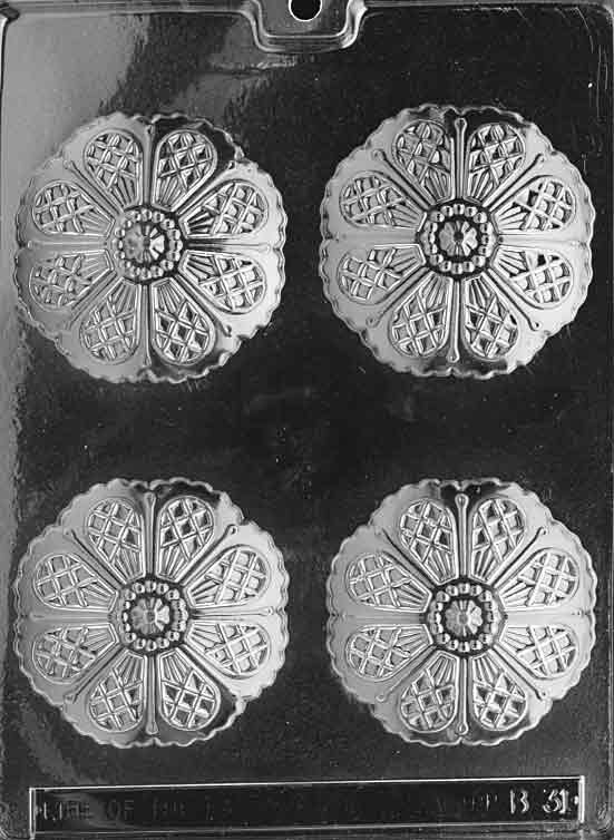 Clear mold with larger round umbrella-top cavities; ribbed segments visible; shallow dome.