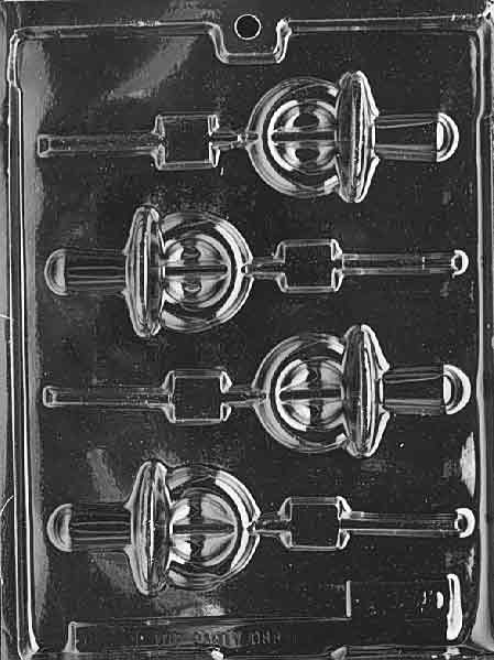 Clear mold with pacifier-shaped lollipop cavity featuring round shield and looped handle; centered stick channel.