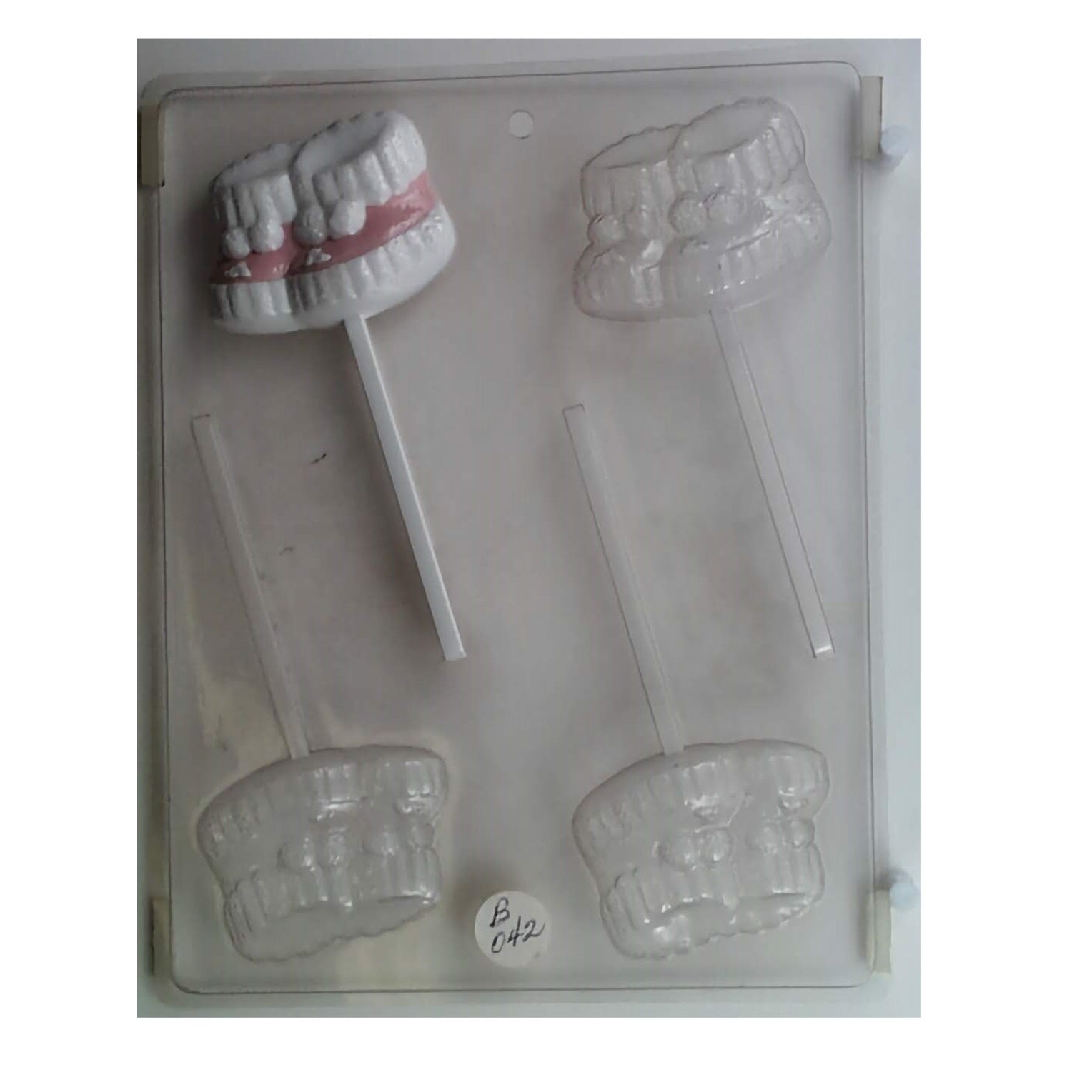 Adorable baby booties sucker mold with intricate details, perfect for baby shower chocolate lollipops or edible decorations.