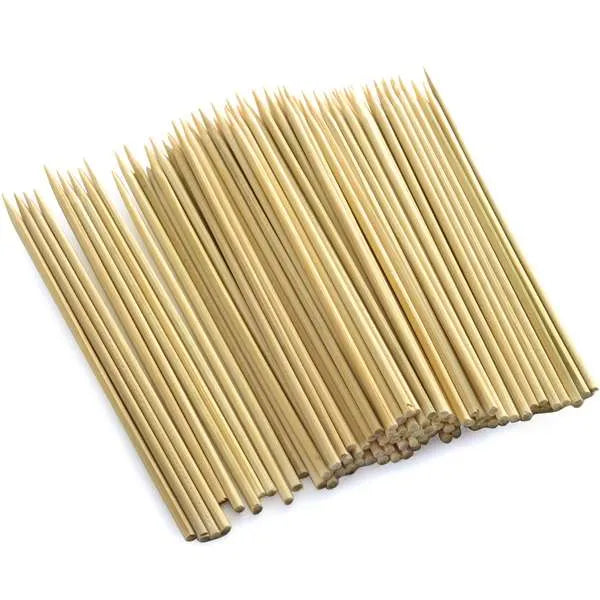 Overhead view of a 100-pack of bamboo skewers, neatly aligned with sharp ends visible.