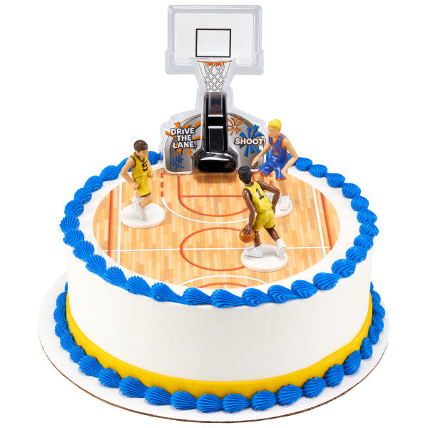Round basketball cake featuring player figurines and a detailed backboard set with court-themed icing.