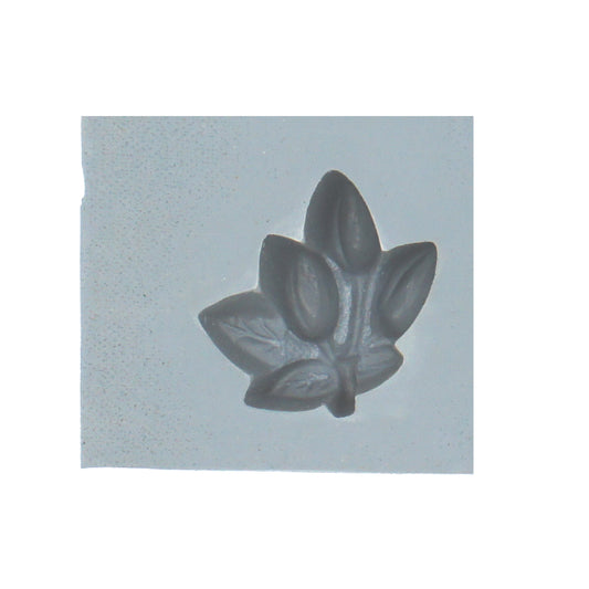 Close-up of berries and leaf rubber mint mold for candy or cream cheese mints