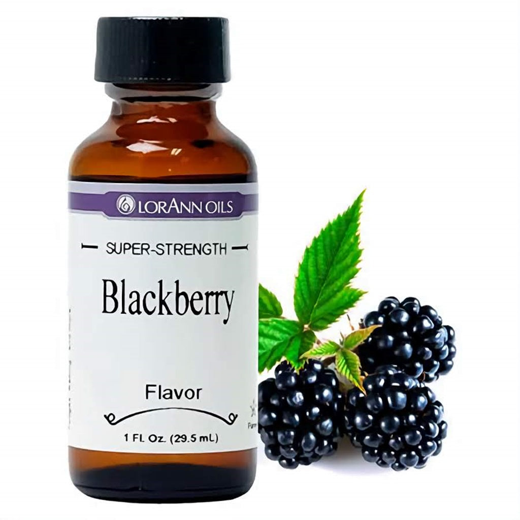 LorAnn Oils Super Strength Blackberry Flavor in a 1 fl oz bottle, next to lush blackberries with green leaves, representing the natural berry flavor.