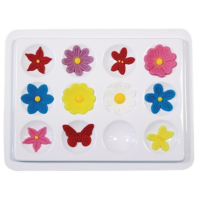 JEM blossom and petal former tray with 12 rounded cups, shown with colorful sugar flowers and butterflies for drying and shaping.