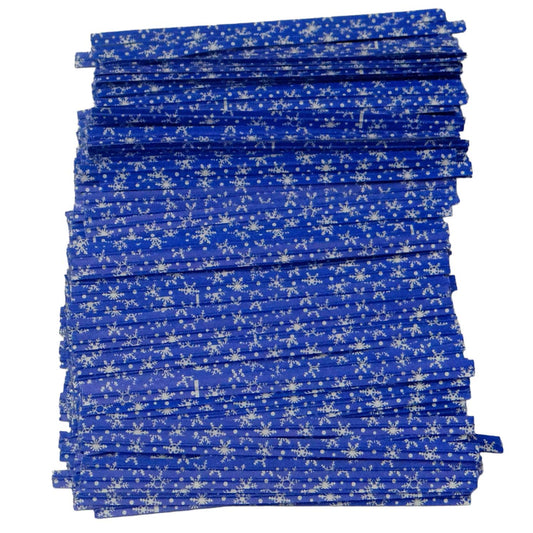 Stack of blue paper twist ties with white snowflake pattern, perfect for sealing holiday treat bags or seasonal packaging