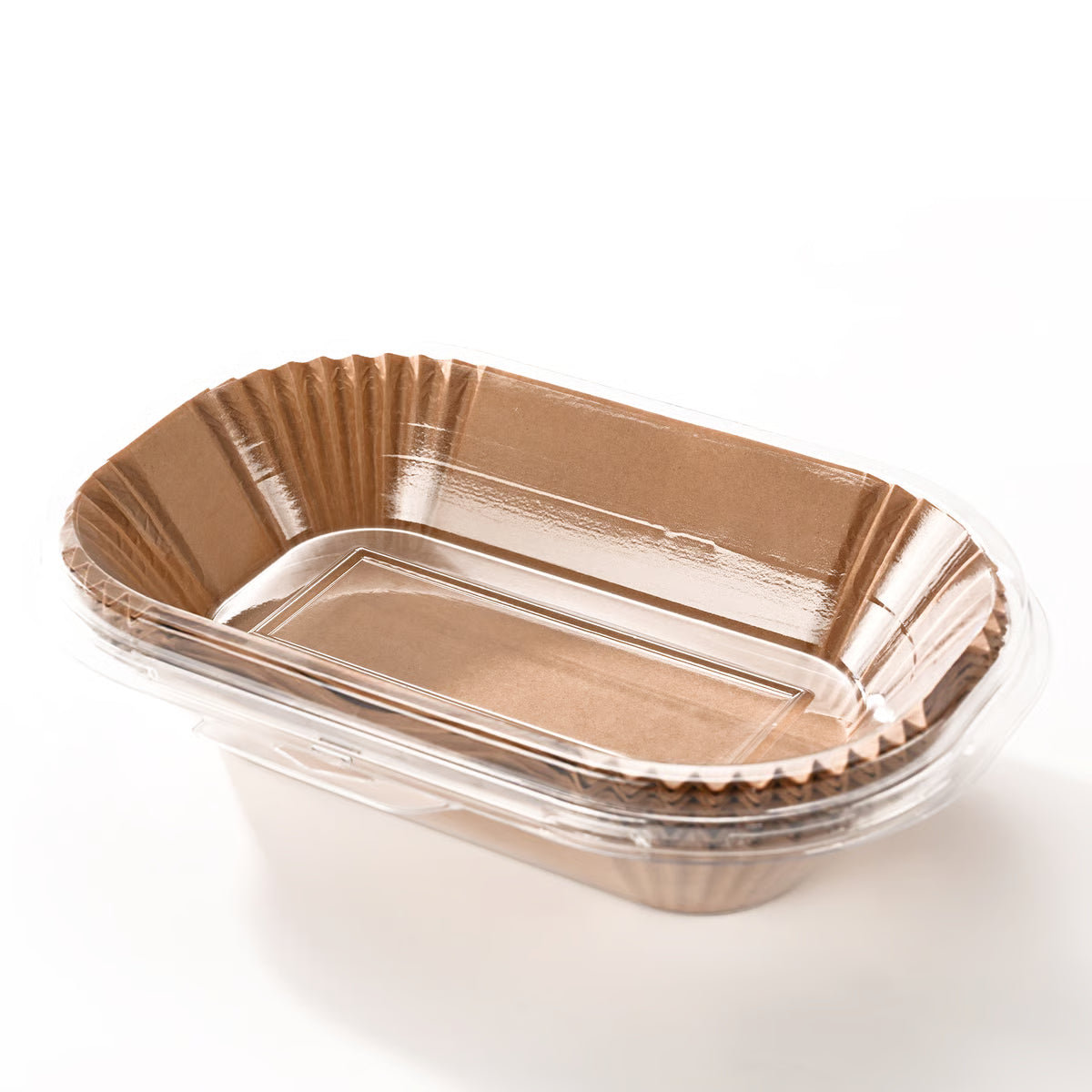 Stack of tan parchment paper loaf pan liners shaped to fit a 9 x 5 inch loaf pan, shown on a white background.