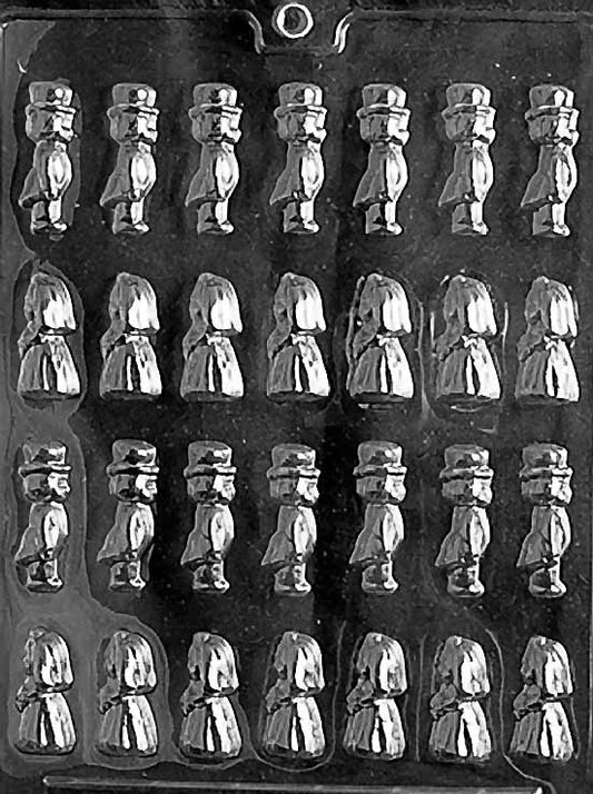 Clear multi-cavity chocolate mold featuring tiny bride and groom figures in rows, with top hats and gowns visible; glossy plastic sheet shown against a dark background.