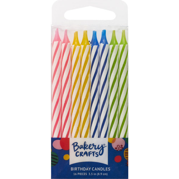 Pack of 16 tall spiral birthday candles in bright pink, yellow, blue, and green, displayed in a clear package labeled "Bakery Crafts."
