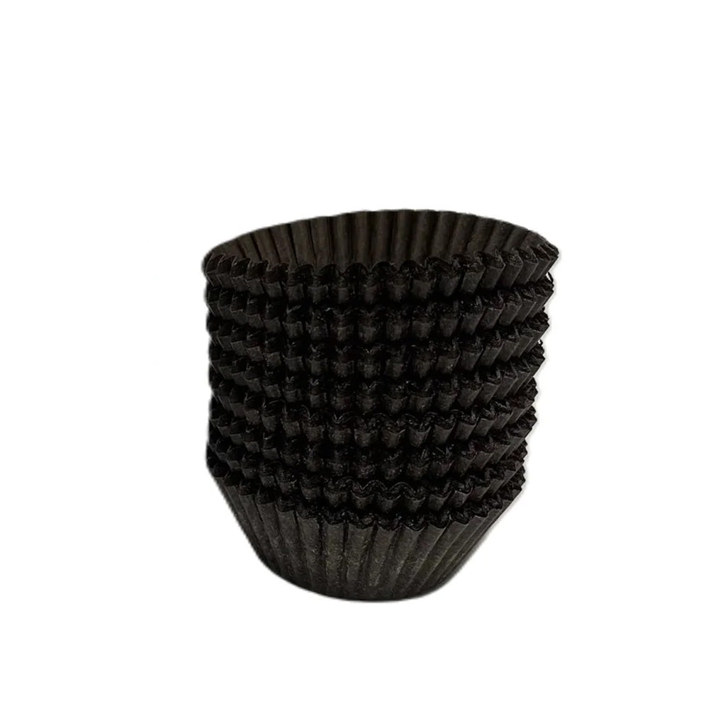 Stack of brown fluted paper candy cups with tight accordion folds, shown on a white background.