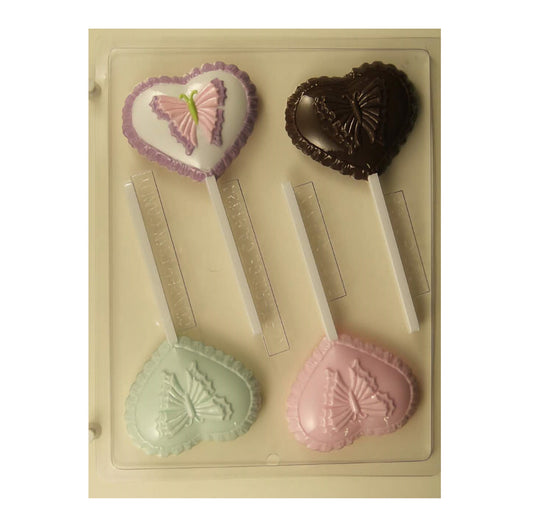 Heart-shaped chocolate sucker mold with embossed butterfly designs, displayed with three examples of finished chocolates in purple, brown, and pink, showcasing the intricate details of the butterflies.