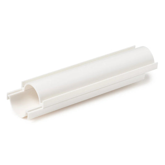White two-piece cake pop roller shown assembled at an angle, featuring a long rounded channel with raised side rails on a white background.