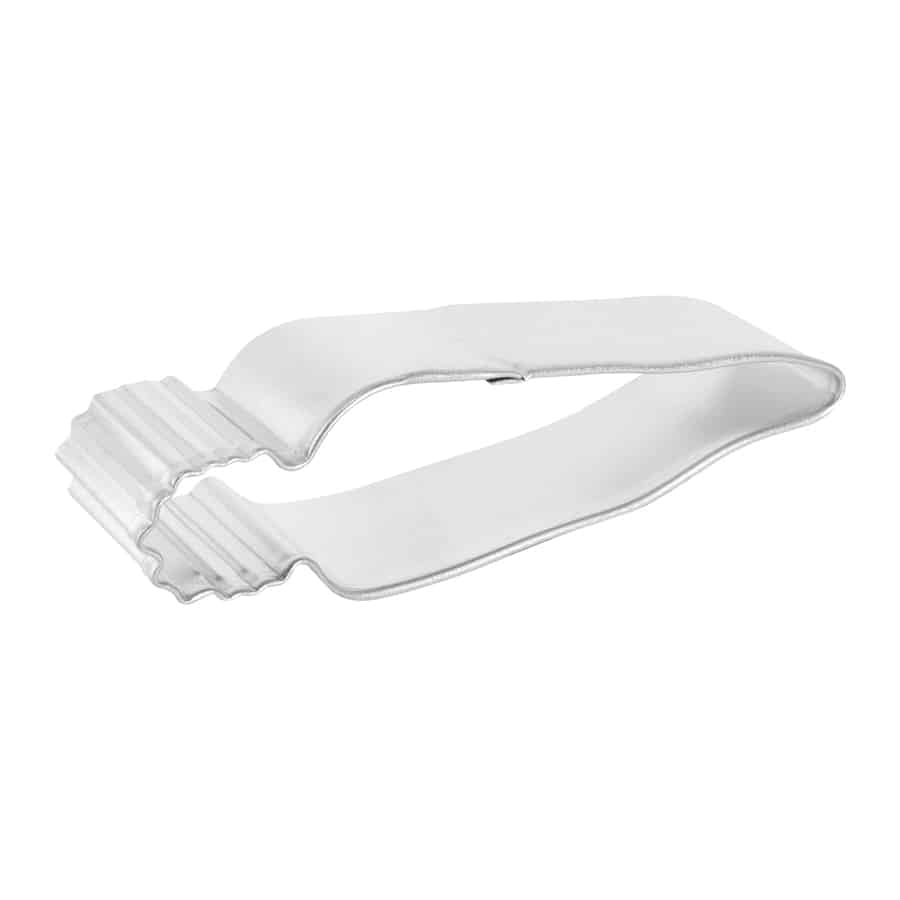 Side-angle view of a metal carrot cookie cutter showing its length and ridged top detail.
