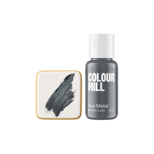 Colour Mill Gun Metal Metallic Paint Blend bottle beside a white square confection decorated with a textured brushstroke of dark metallic grey edible paint.