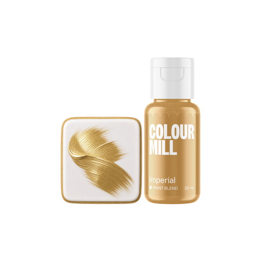 Colour Mill Imperial Metallic Paint Blend bottle beside a white square cookie decorated with a sweeping textured brushstroke of rich imperial gold edible paint.