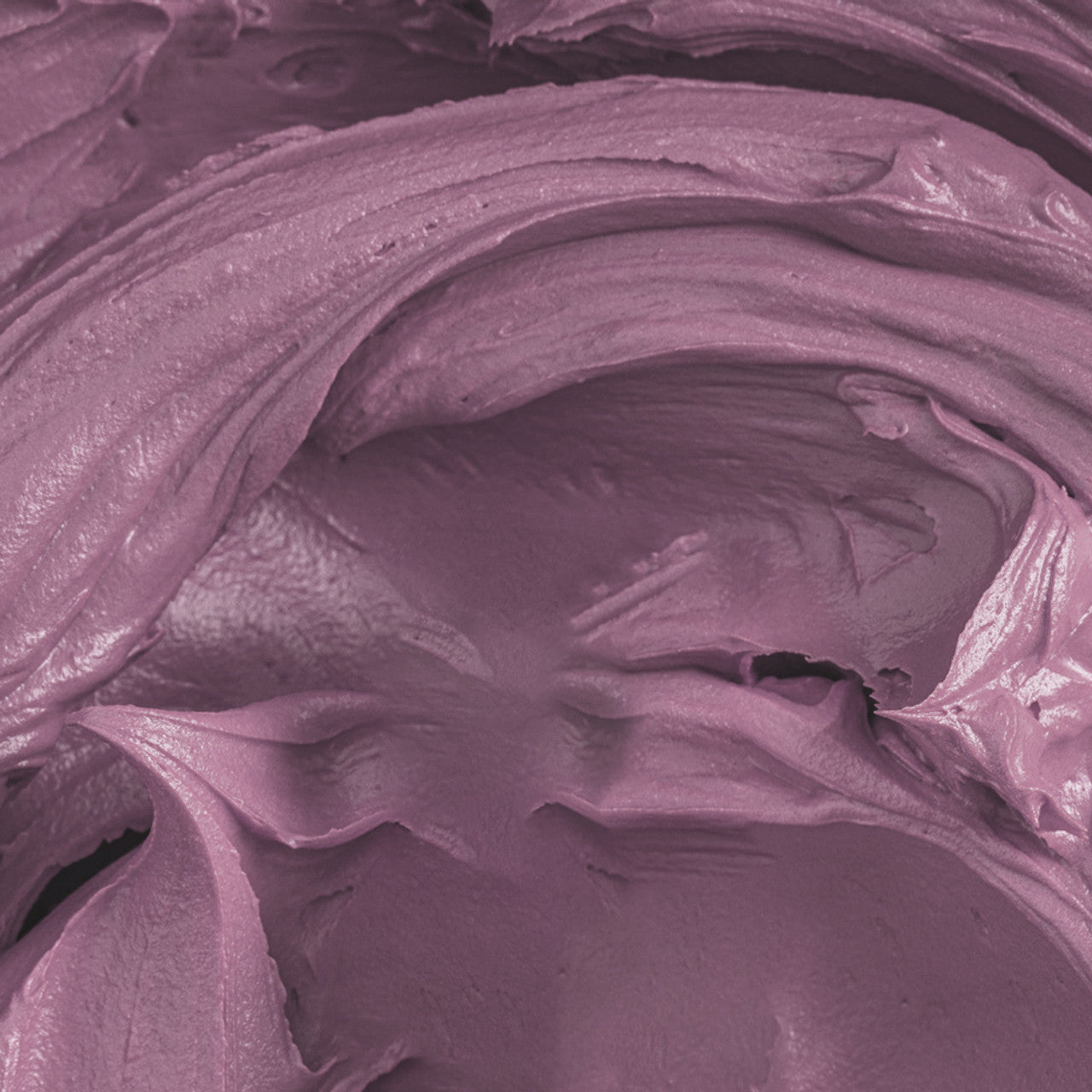 Close-up of buttercream colored with Colour Mill Mauve, showcasing its rich and smooth purple-pink tone.