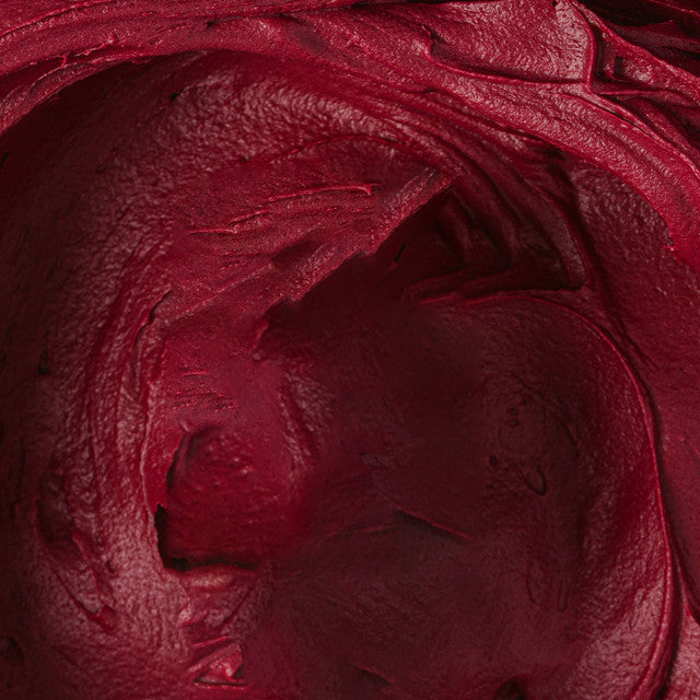 Close-up of dark red buttercream tinted with Colour Mill Merlot, showing smooth texture and saturated colour