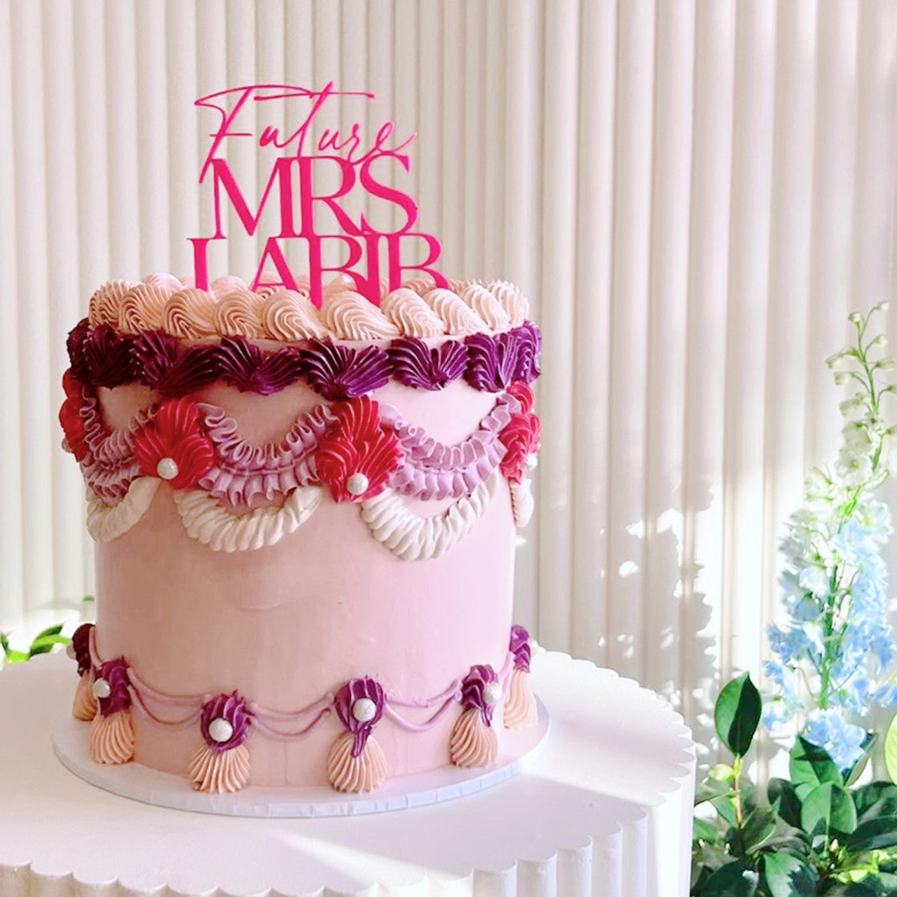 Vintage-style cake decorated with pink buttercream using Colour Mill Rose food coloring