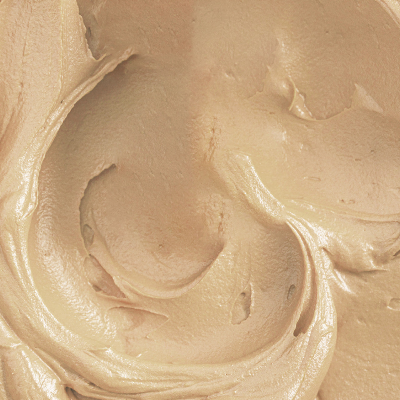 Buttercream swirl tinted with Colour Mill Sand, showing a rich creamy neutral tone