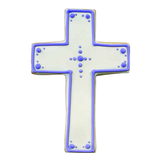 White cross-shaped cookie decorated with purple icing dots and border, perfect for religious celebrations like confirmations and baptisms.