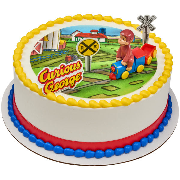Round cake decorated with Curious George train topper and railroad signs on a printed background