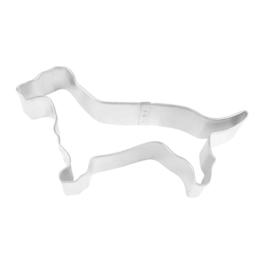 Overhead view of a metal Dachshund-shaped cookie cutter, showcasing the breed’s long body and short legs.