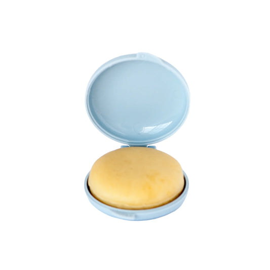 Open disc cake pop mold with a perfectly shaped dough disc inside, showing smooth surface ideal for decorating.