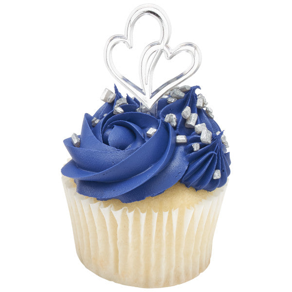 Navy blue frosted cupcake with silver sprinkles and a silver double heart pick as a topper.