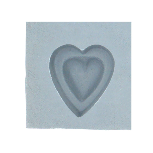 Close-up view of a single cavity in the Double Heart Rubber Mint Mold, featuring a layered heart design for candies and mints.